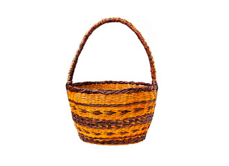 Wicker brown basket with handles isolated on a white background