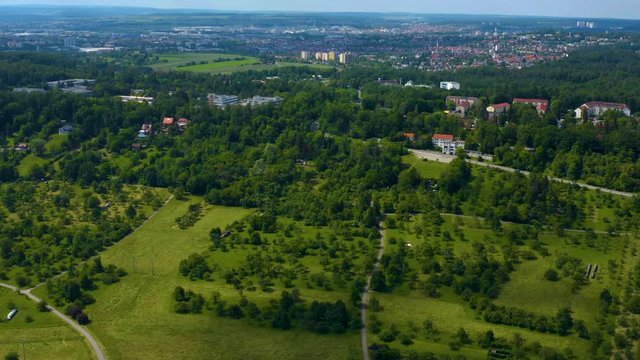 Aerial view of Böblingen in Germany. Ascending behind hills revealing the city.