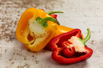 red and yellow peppers on light color background