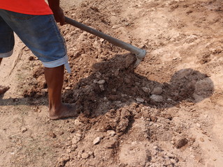 a farmer is working in the fields with his tools