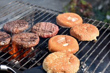 cooking burgers in nature on fire