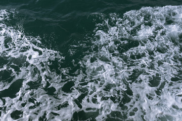 Blue water in the ocean or in the sea. Turquoise waves and Aqua Mente and Phantom Blue. Photos for wallpaper or for background. Abstraction of the waves. Thailand