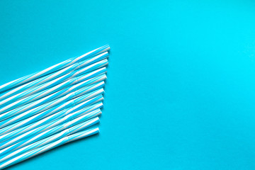 
Straw of blue juice on a blue background