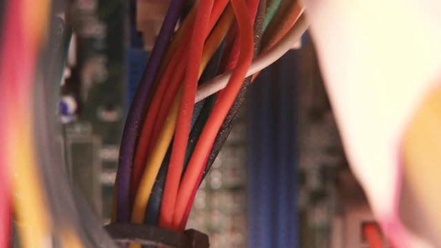 Computer power cables inside PC, macro. the bunch of wires inside of old pc , commutation and elements connection. Broken PC.