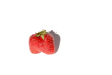 Red strawberry on a white background close-up isolated.