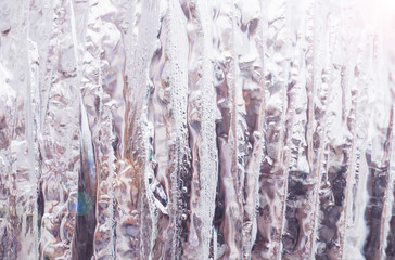 Obraz premium ice texture, cracked stripes and sharp edges of glass frozen water, frosty background