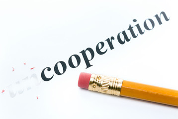 Word " uncooperation " and pencil with eraser close-up