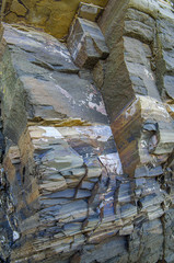 Color rock close up. Natural forms in stone structure. Background, texture. - 323946825