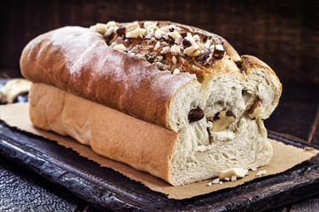 Brazil nut bread, bread made with Brazil nuts, known in Portuguese as castanha do pará. Homemade vegan product, totally organic. Bread on rustic wooden background, image of confectionery.