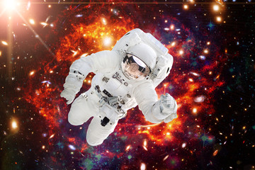Astronaut against deep space. The elements of this image furnished by NASA.