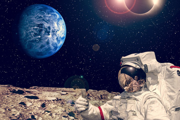 Obraz premium Astronaut on the alien planet. Stars above. The elements of this image furnished by NASA.