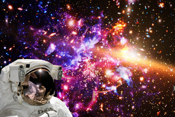 Fototapeta na wymiar Astronaut against deep space. The elements of this image furnished by NASA.