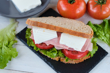 Ham and cheese sandwich with tomato and lettuce