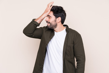 Young handsome man with beard over isolated background has realized something and intending the solution