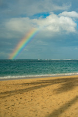 View of a Rainbow Over the Pacific Ocean from  the Beach in Hawaii