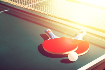 Table tennis rackets and ball on the table