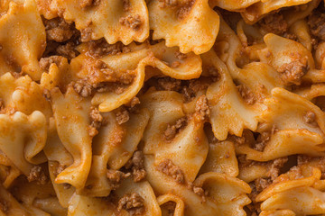 Bolognese sauce farfalle pasta texture macro still