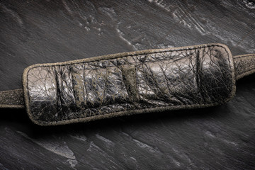 sign, blank for text, place for inscription, copy space-leather black old worn handle from the bag...