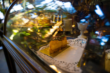 Cheese Cake in a glass cabinet
