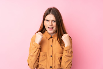 Ukrainian teenager girl over isolated pink background frustrated by a bad situation