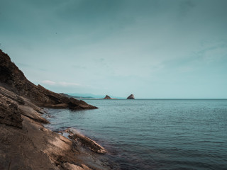 Rocky coast of the sea of Japan, seascape on a warm autumn day