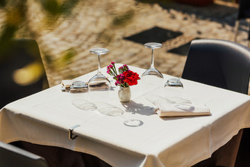 Table setting. Beautiful decorations in open air table setting. Close up view of restaurant table...