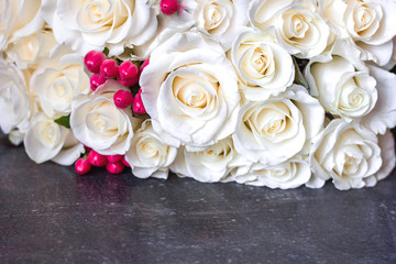 Greeting card Mother's Day International Women's Day March 8 with a bouquet of white roses in out of focus on a blue bokeh background. Copyspace - Love and Wedding Day concept