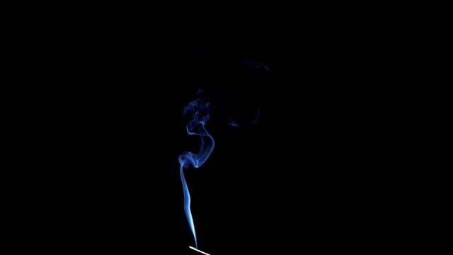 Real Smoke on black. Graceful Bends of the Blue Smoke. Natural Colorful smoke rises up and spins into graceful spirals. Footage is perfect for the layer with different blending modes.