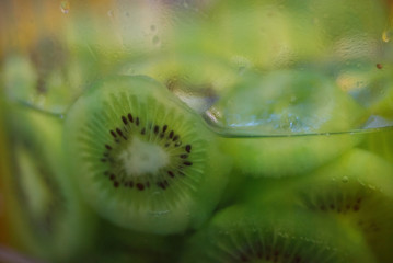 Lush green kiwi slice in a glass