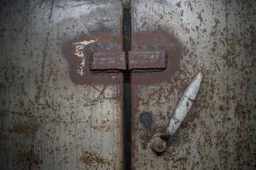  Antique old metal door handle in 2nd world war air raid shelter bunker, Berlin, Germany