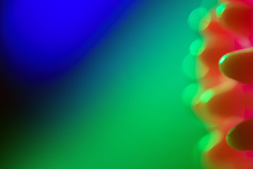 Close-up of a red  bacterium , infection floating in a green ,blue liquid.  Chinese Coronavirus