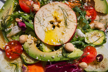 Fresh salad of nuts, organic fruit and vegetables. Vegetarian and vegan food