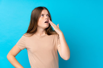 Fototapeta premium Ukrainian teenager girl over isolated blue background yawning and covering wide open mouth with hand