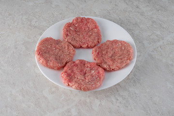 Steaks on a white plate, the concept of proper nutrition.