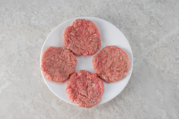 Steaks on a white plate, the concept of proper nutrition.