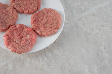 Steaks on a white plate, the concept of proper nutrition.