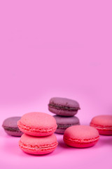 Macaroons on a pink background.