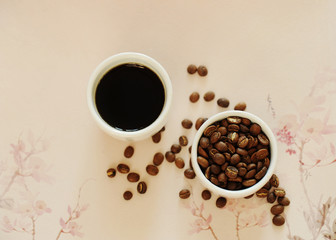 China specialty coffee concept. Two white cups: roasted beans and espresso. On chinese pattern background. Top view