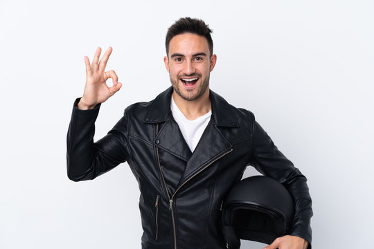 Man with a motorcycle helmet showing ok sign and thumb up gesture