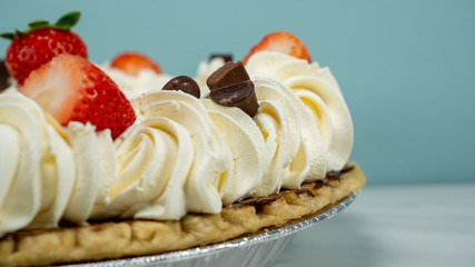 Pie Strawberry Chocolate Whipped Cream Brown Wood Marble Pineapple Blue Yellow Plate Settings