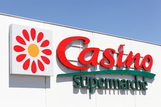 Vaulx en Velin, France - June 13, 2019: Casino supermarket logo on a wall. Casino is a hypermarket and supermarket chain based in Saint Etienne, France