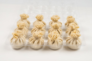 Khinkali on white background.