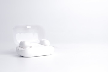 Wireless earphone on white background