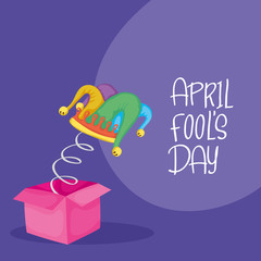 happy april fools day card with surprise box and buffoon hat