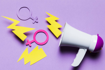 Loud megaphone with feminine and masculine gender signs