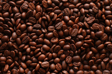 Natural coffee bean background. Dark roasted beans for espresso. Natural ingredient, agriculture, coffee shop, backdrop concept