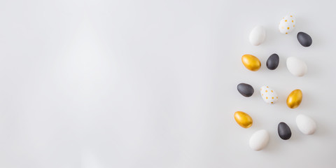 Flat lay pattern with a easter eggs on a white background