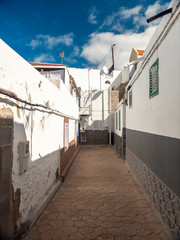Beautiful image of narrow street of small seaide town in Greece