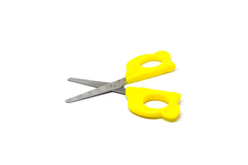 Yellow scissors isolated on white background