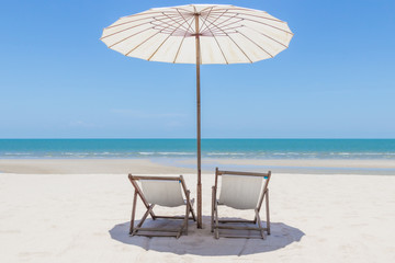 Idyllic tropical beach with white sand, turquoise ocean water and blue sky in huahin thailand